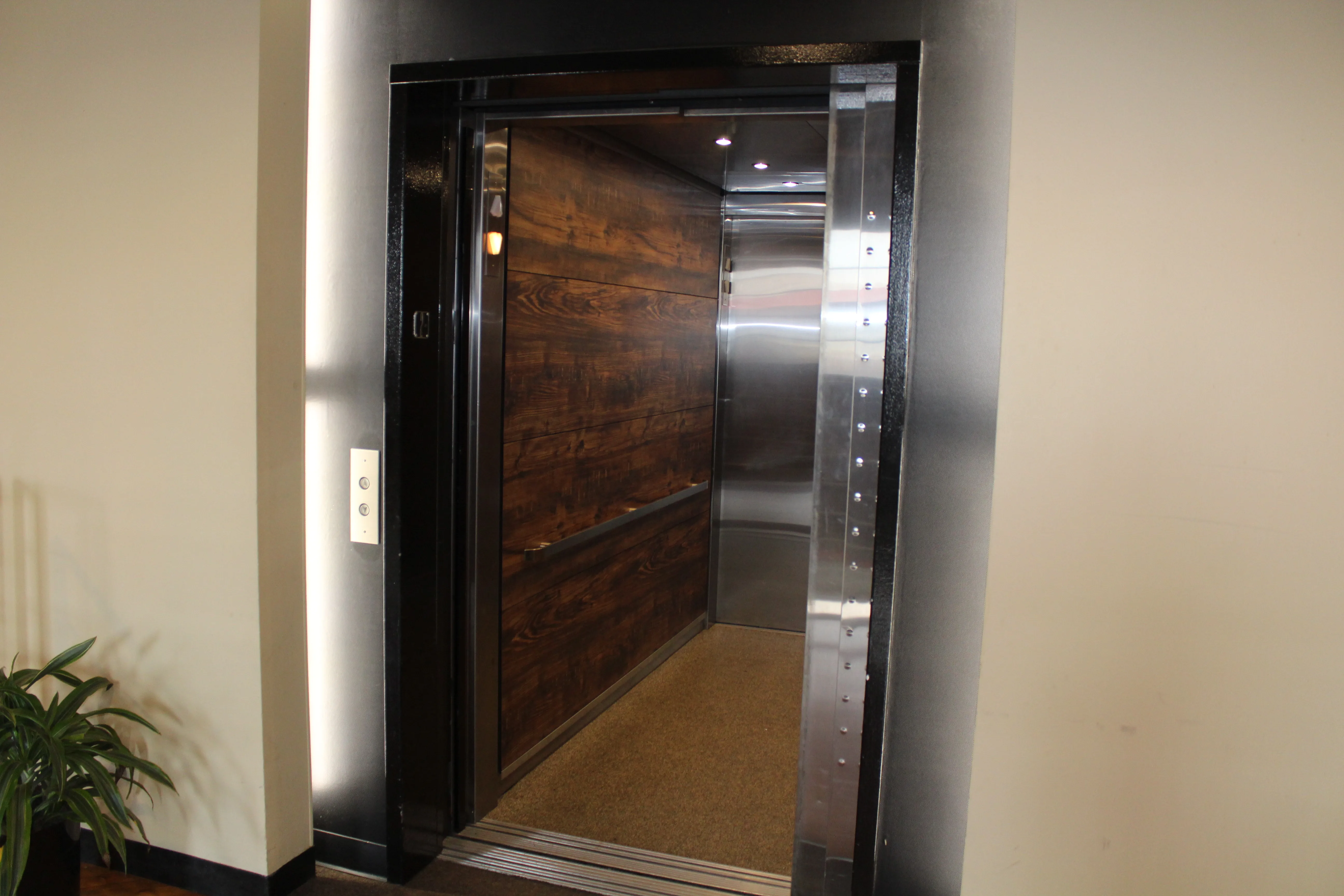 Technician inspecting elevator components